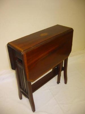 Appraisal: AN EDWARDIAN MAHOGANY SUTHERLAND TABLE of canted oblong form with