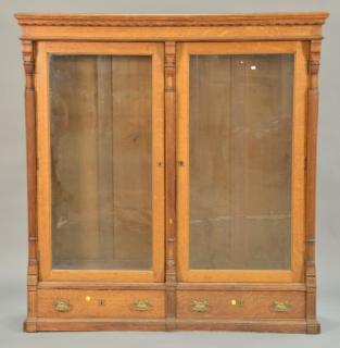 Appraisal: Victorian oak two door bookcase with two drawer base ht