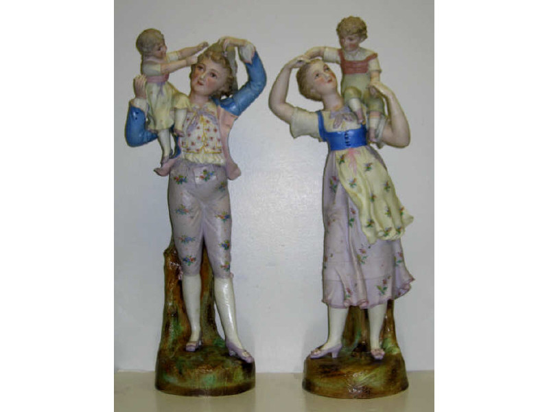 Appraisal: PAIR OF GERMAN BISCUIT PORCELAIN FIGURES Depicting a maiden and