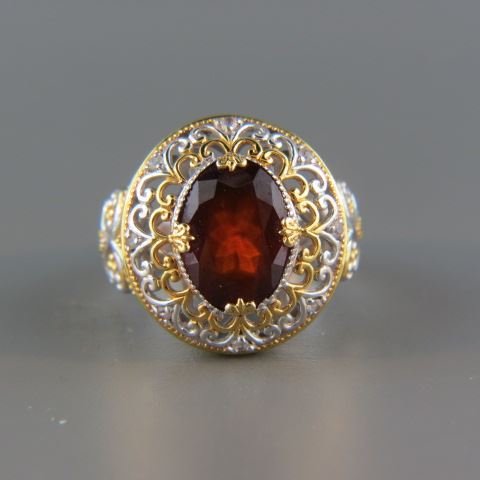 Appraisal: Garnet Ring rich oval gem in fancy gold and silver