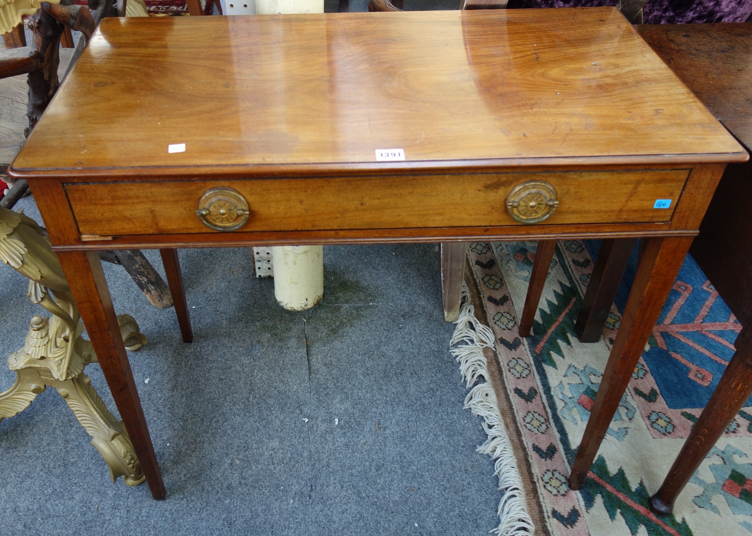 Appraisal: A George III mahogany single drawer side table on tapering