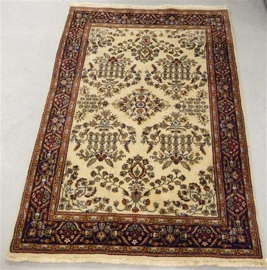 Appraisal: Rug with cream field and navy accent handknotted ' ''