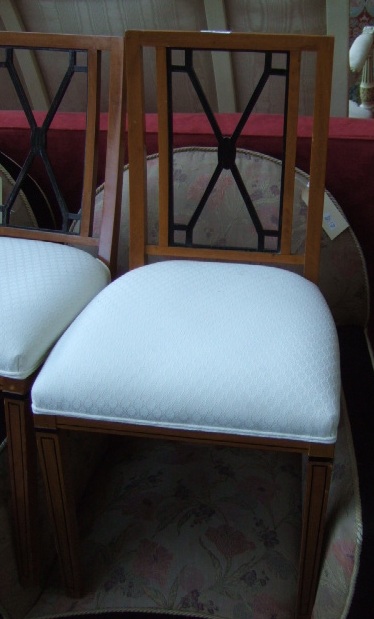 Appraisal: A set of four Biedermier satin birch dining chairs with