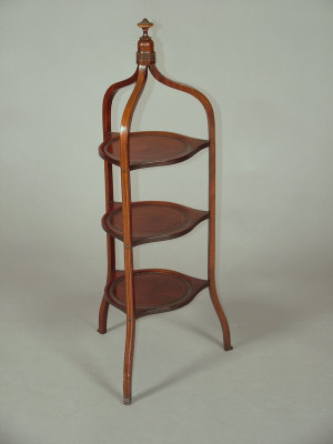 Appraisal: A mahogany three tier cake stand mid th century the