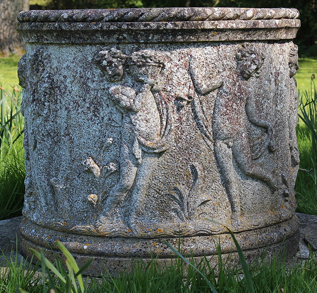 Appraisal: A CYLINDRICAL CAST RECONSTITUTED STONE WELL HEAD with rope edge