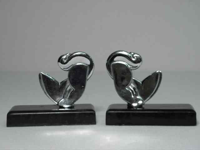 Appraisal: Pair chrome art nouveau bird bookends Two piece joined at