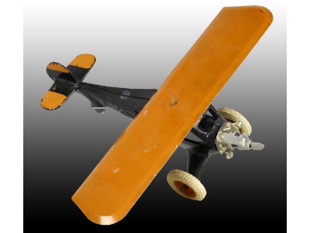 Appraisal: Arcade Large Monocoupe Airplane Toy Description Black fuselage and orange