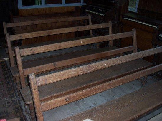 Appraisal: Four church pews with rail backs and solid seats on