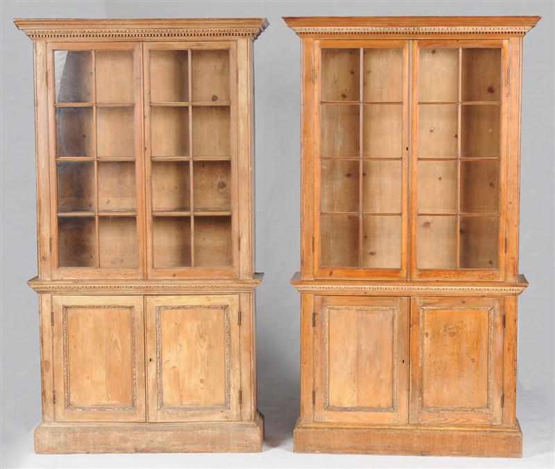 Appraisal: PAIR OF GEORGE III CARVED PINE BOOKCASES Each cornice with