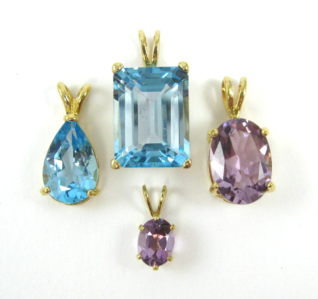 Appraisal: FOUR COLORED GEMSTONE PENDANTS including two blue topaz pendants and