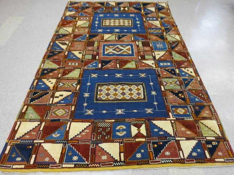 Appraisal: HAND KNOTTED MOROCCAN CARPET repeating geometric panel design pile and