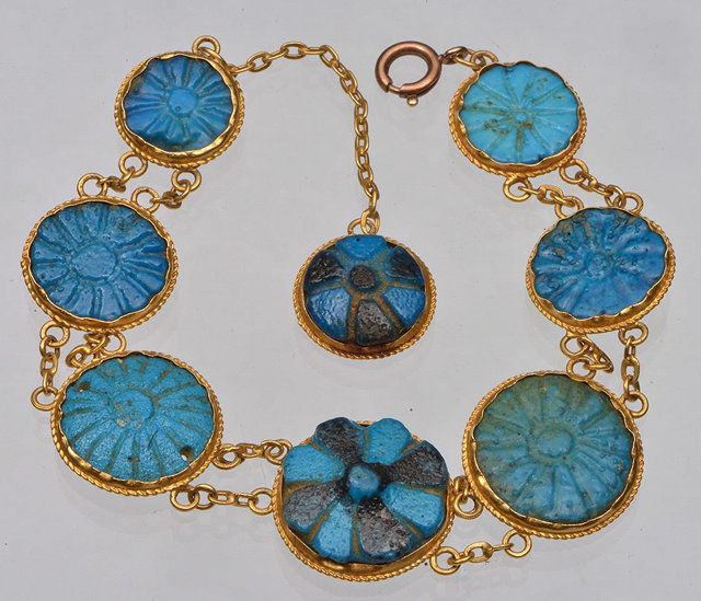 Appraisal: A MIDDLE EASTERN PANEL BRACELET with inset sand cast glass