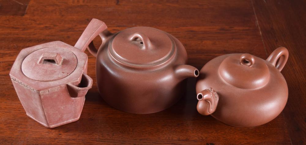 Appraisal: THREE CHINESE ZISHA TEAPOTS each with low profile various forms