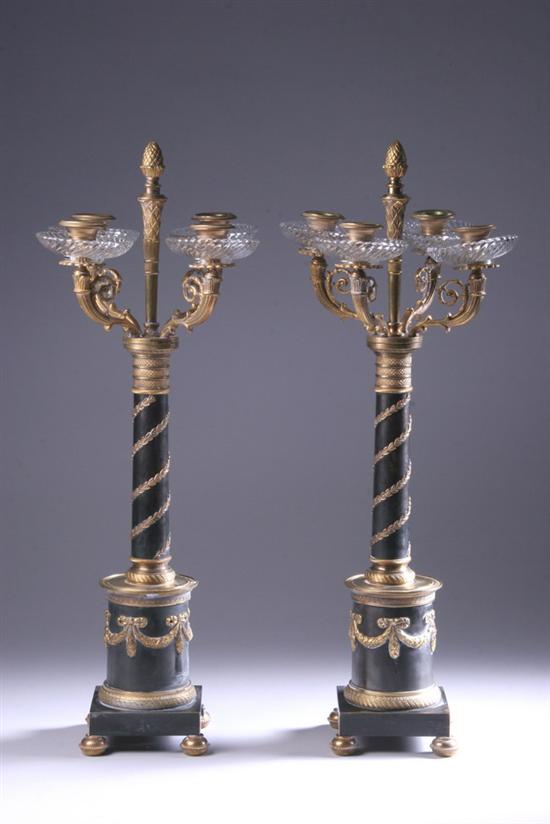 Appraisal: PAIR EMPIRE-STYLE GILT-METAL FOUR-LIGHT CANDELABRA th century paper label reading