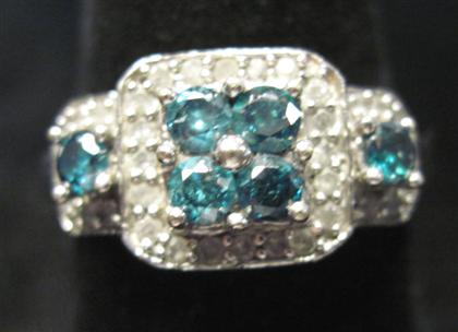 Appraisal: karat white gold and colored diamond ringFour blue round cut