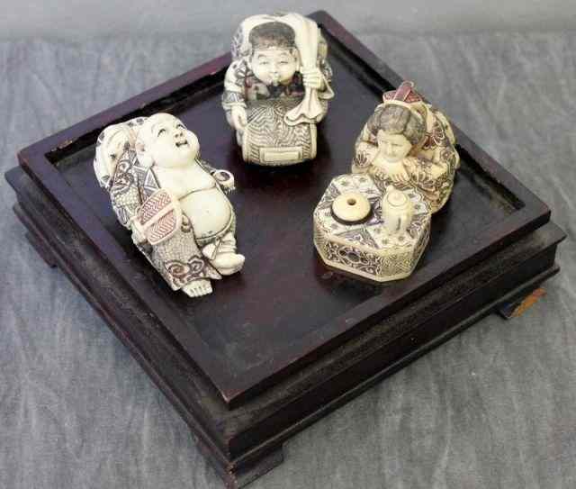 Appraisal: Lot of Dyed Asian Ivory Figures of Two Men anda