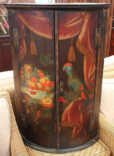 Appraisal: AN TH CENTURY BOW FRONTED CORNER CUPBOARD the doors painted