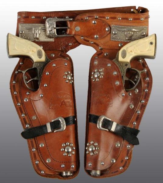 Appraisal: Gene Autry Toy Double Gun Holster Set Description Includes two