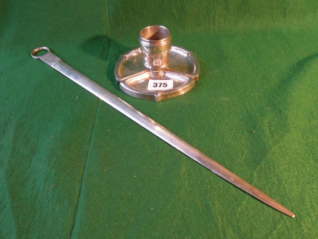 Appraisal: An Art Nouveau silver match striker with central match holder