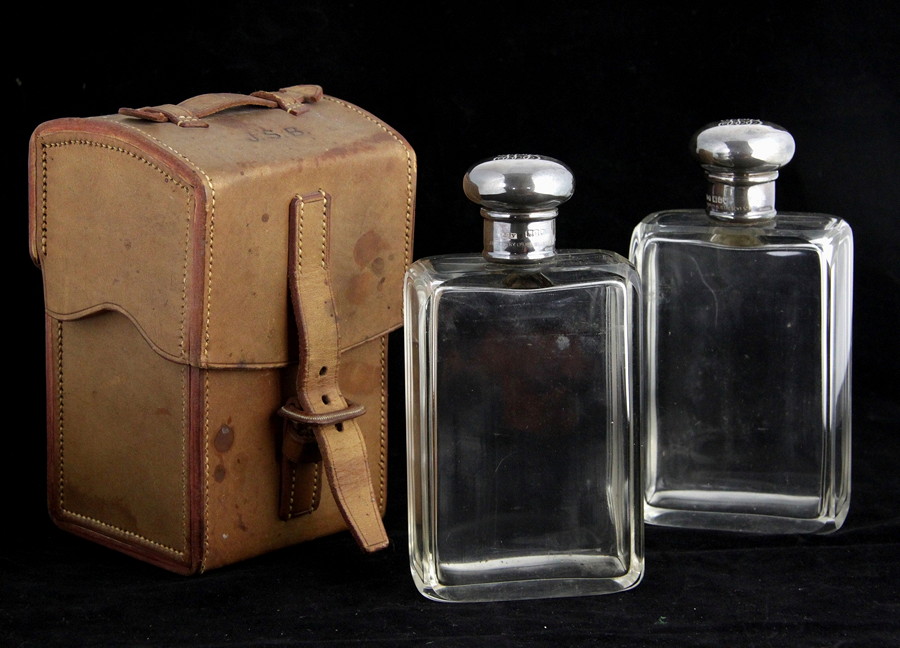 Appraisal: A pair of silver mounted spirit flasks JCV London retailed