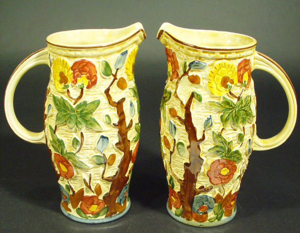 Appraisal: Pair of Woods pottery jugs relief moulded and hand painted