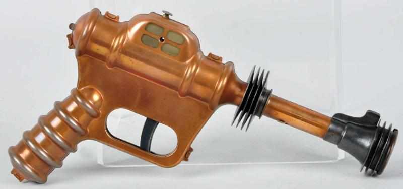 Appraisal: Scarce Buck Rogers Disintegrator Pistol Description Circa Copper-colored pistol number