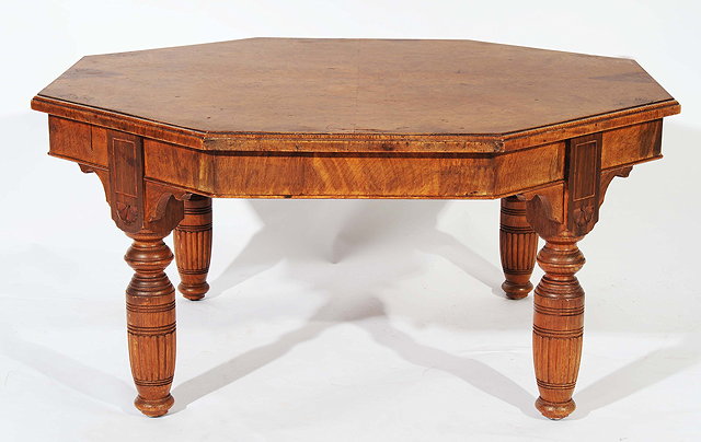 Appraisal: AN OLD OCTAGONAL WALNUT LOW OCCASIONAL TABLE with turned reeded