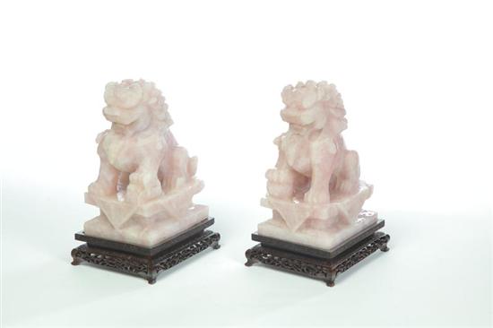 Appraisal: PAIR OF FOO DOGS China th century pink quartz Seated