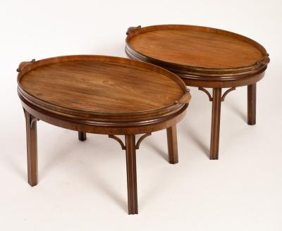 Appraisal: A pair of th Century mahogany brass bound two-handled tables