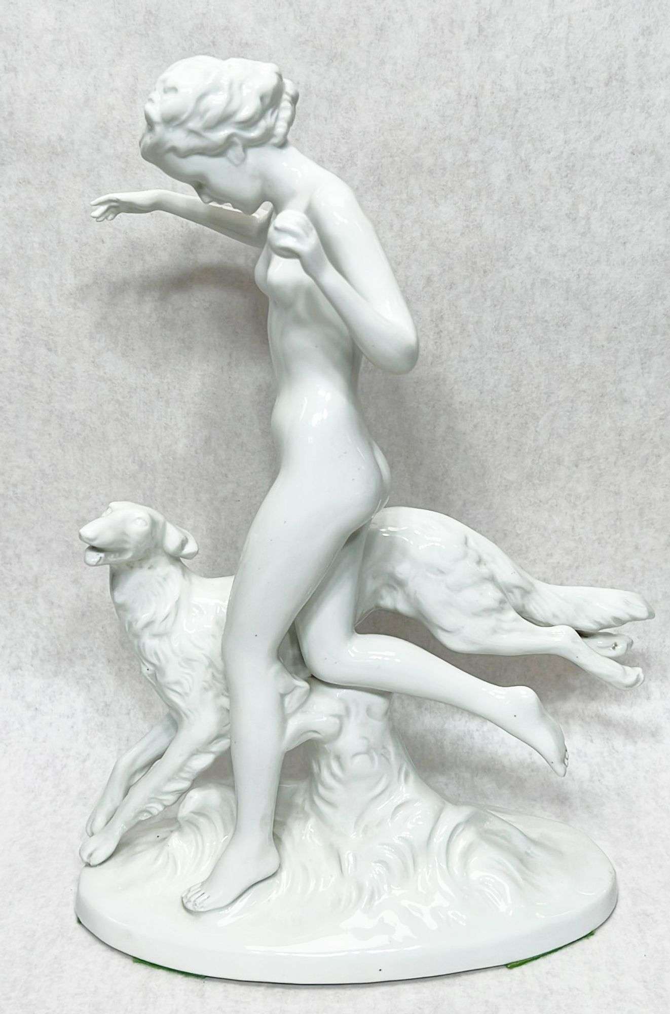 Appraisal: Art Deco Porcelain Nude with Borzoi Figure tall at widest