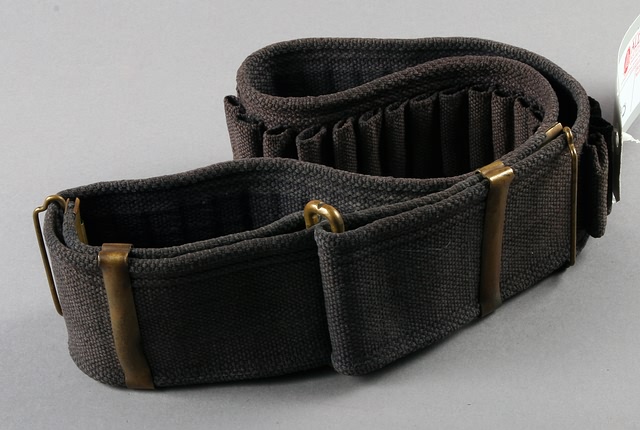 Appraisal: US single loop round cartridge belt dark blue with C