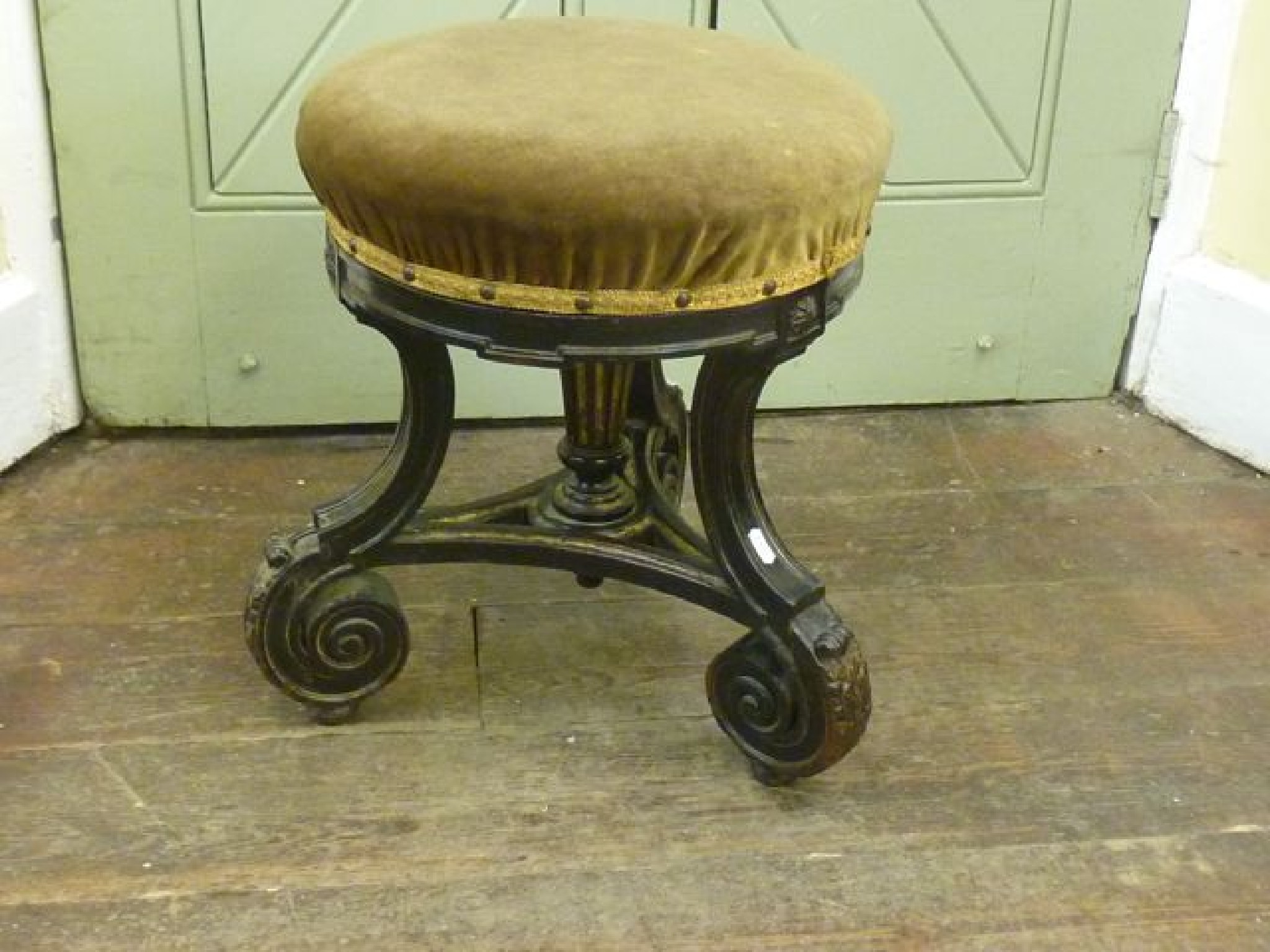 Appraisal: A Victorian music stool the circular top raised on three