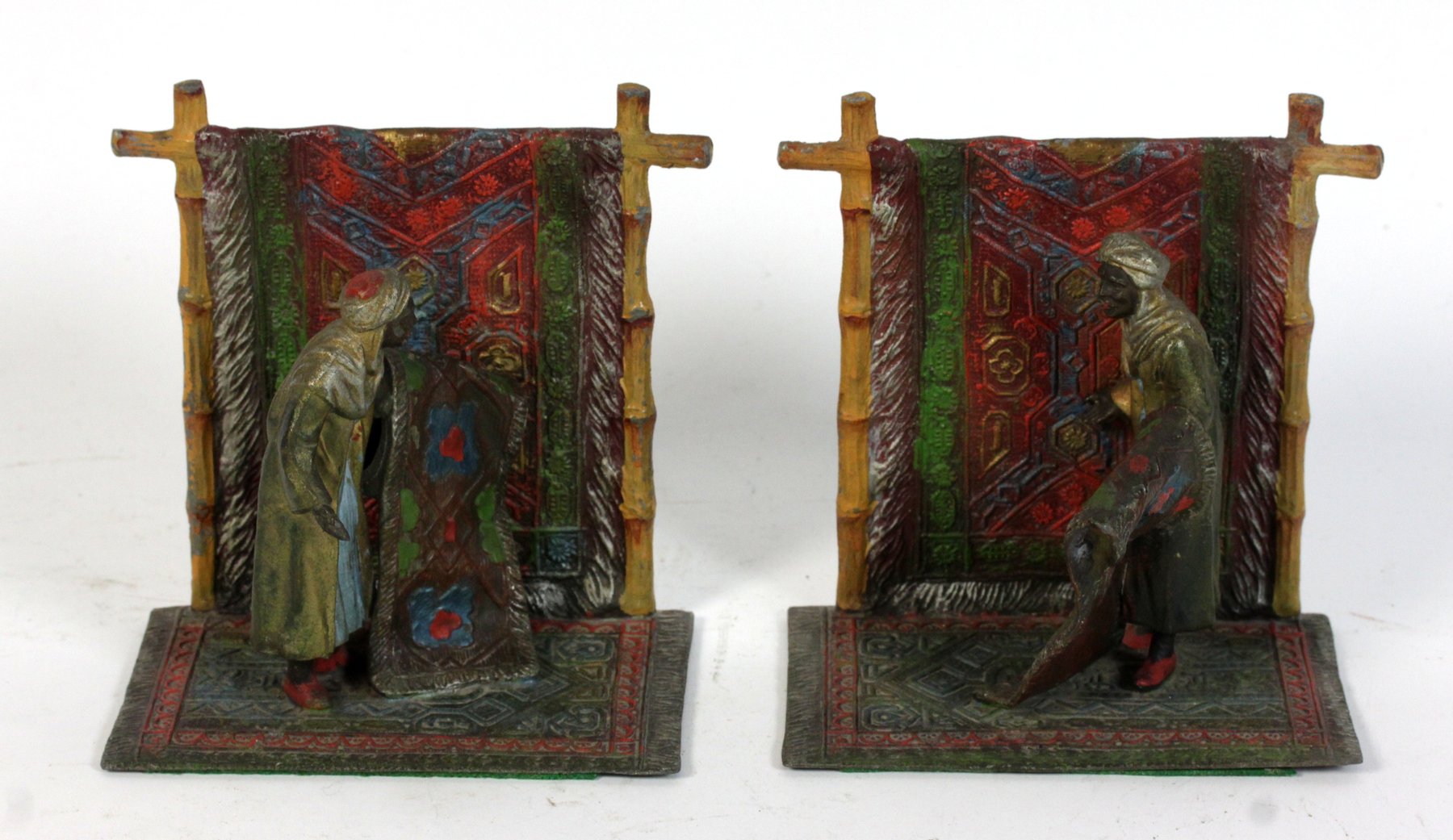 Appraisal: A pair of cold painted figures of carpet sellers each