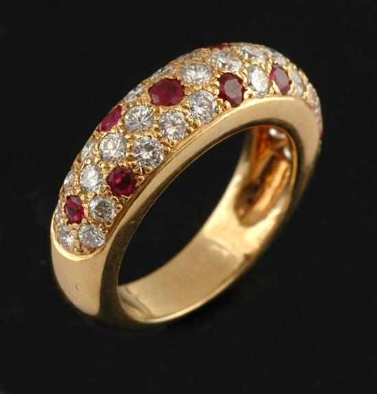 Appraisal: A ruby and diamond ring by Cartier The domed band