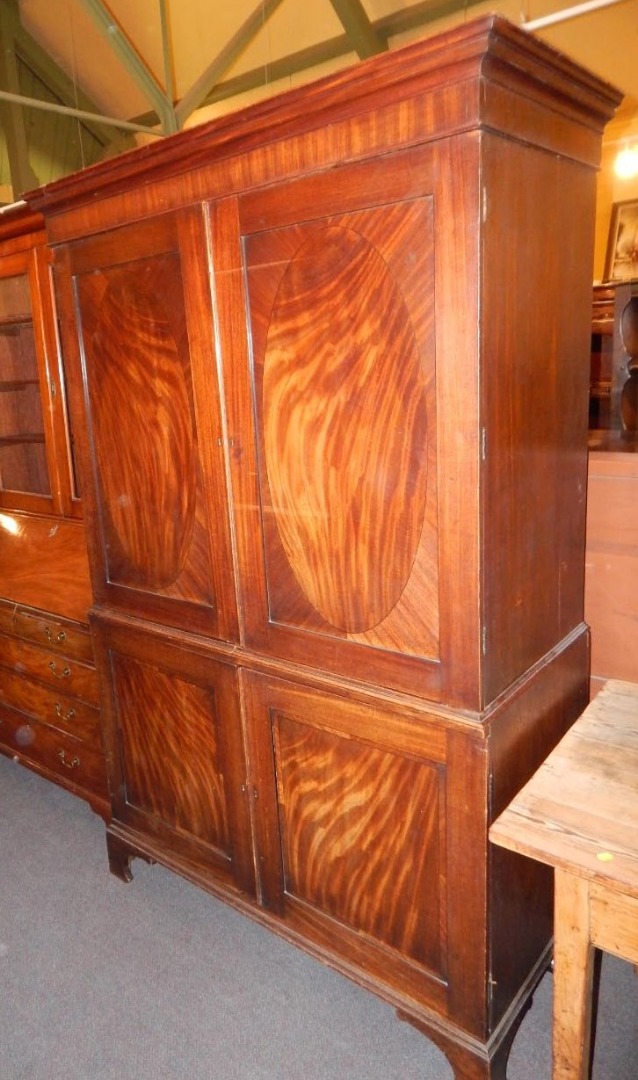 Appraisal: An early thC mahogany wardrobe the top with a moulded