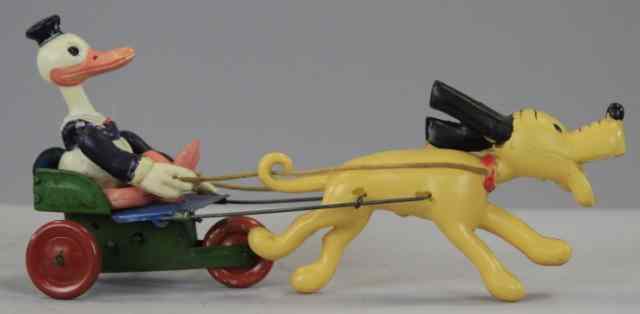 Appraisal: CELLULOID DONALD IN CART PULLED BY PLUTO Japan early toy