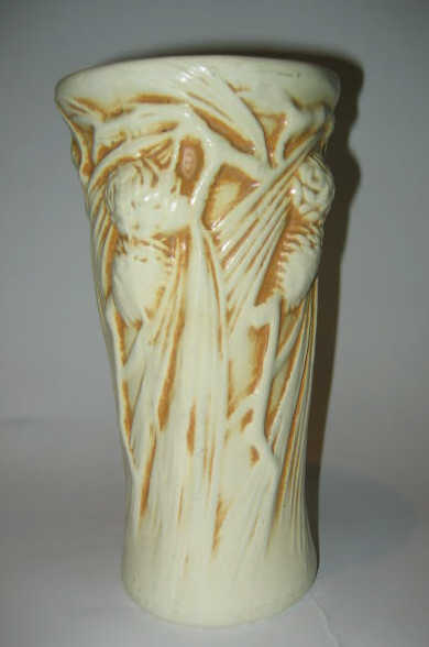 Appraisal: PETERS AND REED POTTERY Ivory glazed vase with pine cone