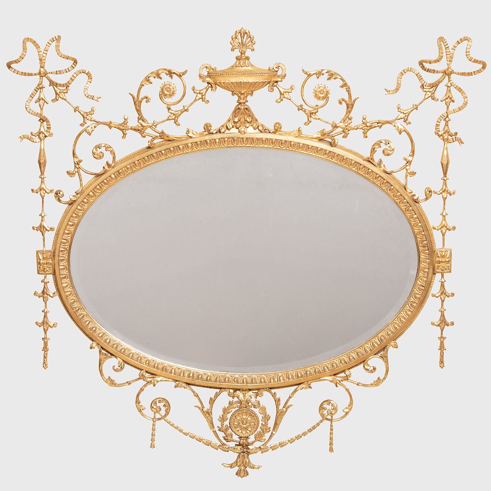 Appraisal: George III Style Giltwood Oval Mirror Fitted with a beveled