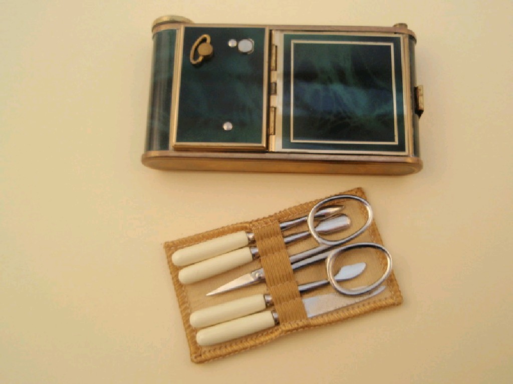 Appraisal: A 's 's combined musical powder compact manicure set and