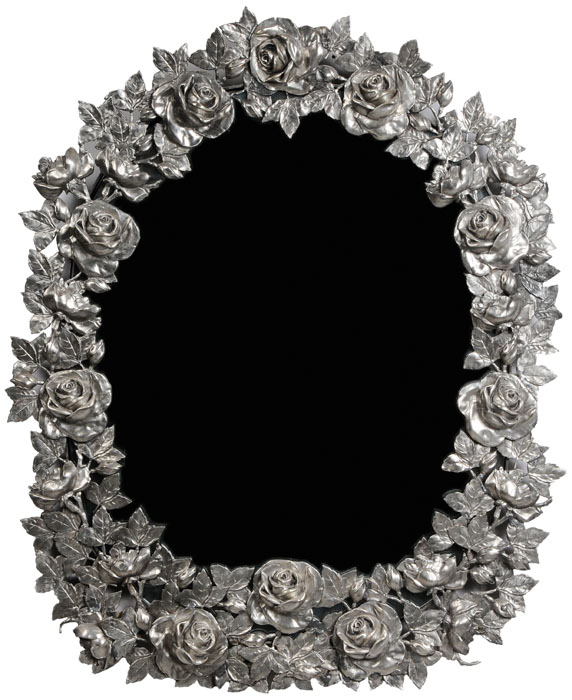 Appraisal: Silvered Metal Floral-Framed Mirror modern hand crafted oval form with