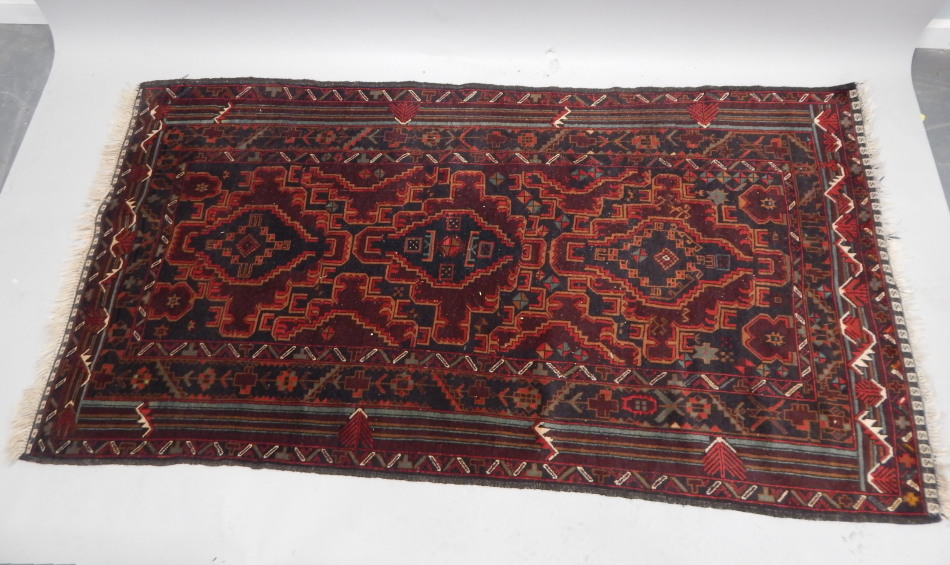 Appraisal: A Persian style rug predominately in blue red and brown