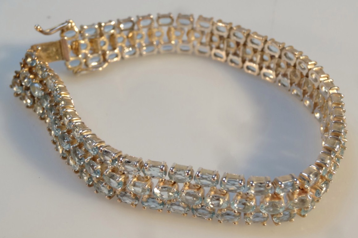 Appraisal: A stone set bracelet with blue stones in three rows