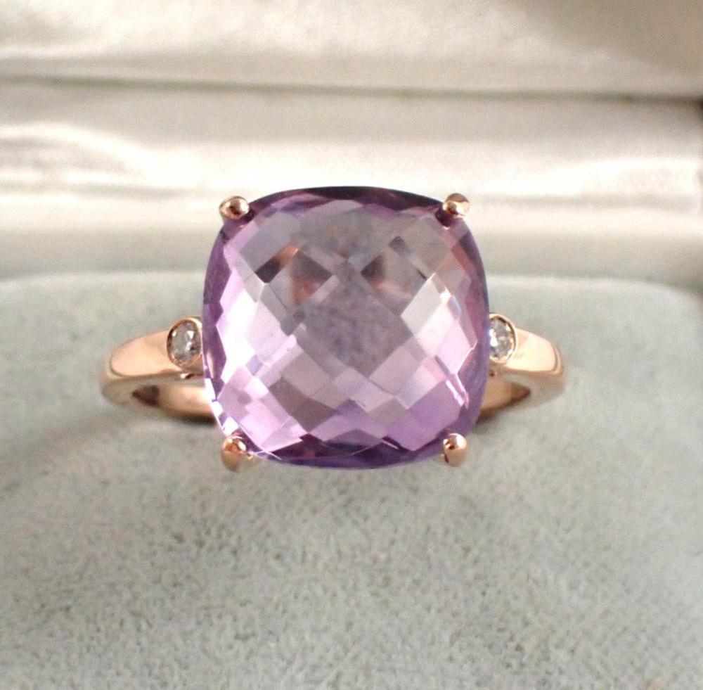 Appraisal: AMETHYST DIAMOND AND FOURTEEN KARAT ROSE GOLD RING set with