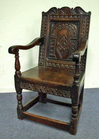 Appraisal: A th Century oak wainscot chair the scrolling crest above