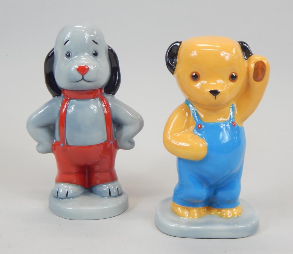 Appraisal: A pair of Wade porcelain figures Camtrak's Childhood Favourites No