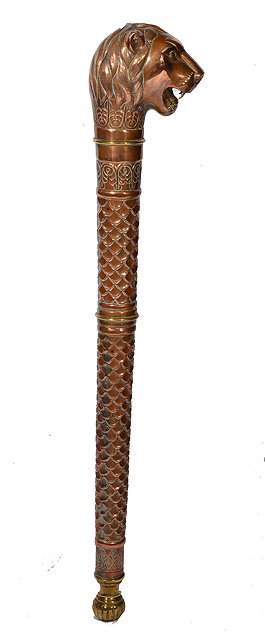 Appraisal: AN INDIAN COPPER AND BRASS MOUNTED SCEPTRE with lions head