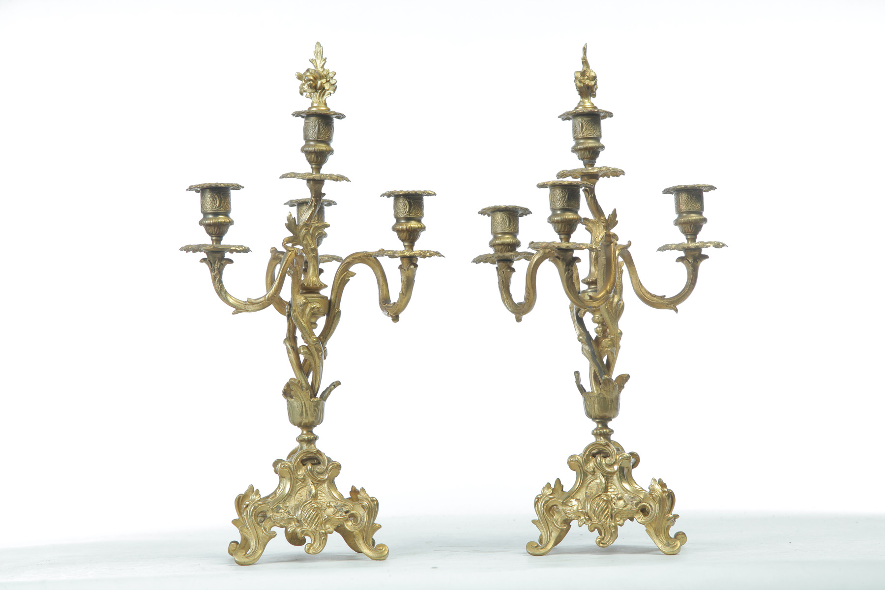 Appraisal: PAIR OF FOUR-BRANCH BRASS CANDELABRAS European th quarter- th century