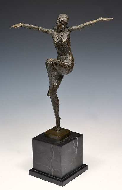 Appraisal: A REPRODUCTION ART DECO STYLE BRONZE MODEL OF A DANCER