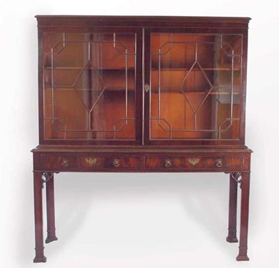 Appraisal: A George III style mahogany cabinet on stand the cavetto