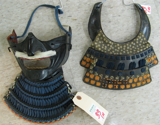 Appraisal: TWO JAPANESE ARMOR PIECES A RESSEI MEN lower armor steel